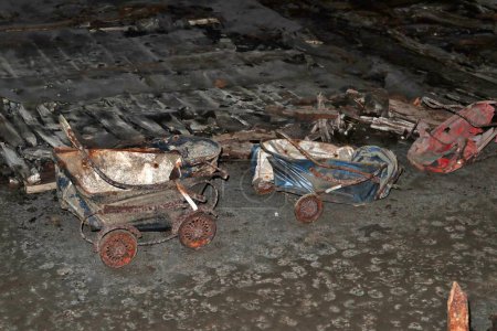 Photo for Naples, Campania, Italy  April 15, 2022: Rusty baby carriages in the Galleria Borbonica - Royalty Free Image