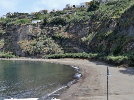 Photo for Monte di Procida, Campania, Italy  May 27, 2021: Free beach adjacent to the Port of Acquamorta - Royalty Free Image