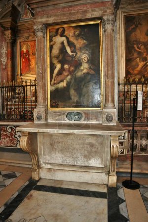 Photo for Naples, Campania, Italy - December 27, 2022: Edicule of Saint Elizabeth with painting of Saint Elizabeth of Hungary by Luigi Rodriguez between the fourth and fifth right chapels of the Church of Santa Maria La Nova - Royalty Free Image