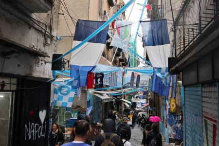 Photo for Naples, Campania, Italy - April 24, 2023: Glimpse of the alleys of the historic center festively decorated waiting for the conquest of the 3rd championship of the Napoli football team - Royalty Free Image