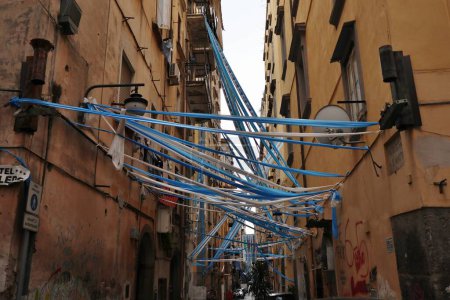 Photo for Naples, Campania, Italy - April 24, 2023: Glimpse of the alleys of the historic center festively decorated waiting for the conquest of the 3rd championship of the Napoli football team - Royalty Free Image