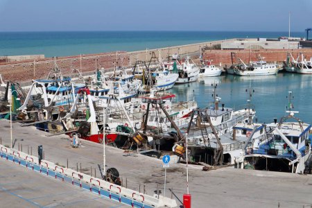 Termoli, Molise, Italy  12 April 2024: The port of Termoli, close to the Borgo Antico, characterized by a pier for fishing boats and the Guardia di Finanza, an intermediate pier for boarding for the Tremiti Islands, and the shipyard pier at the north