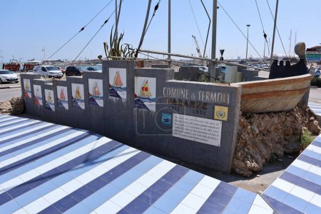 Photo for Termoli, Molise, Italy  12 April 2024: Monument to the Paranze, the typical trawling boats, decorated with 21 porcelain stoneware tiles on the port roundabout - Royalty Free Image
