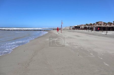 Photo for Lido di Ostia, Lazio, Italy - May 3, 2024: Lungomare Toscanelli beach with rough sea - Royalty Free Image