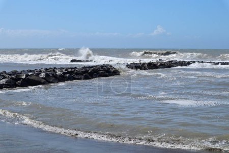 Lido di Ostia, Lazio, Italy - May 3, 2024: Lungomare Toscanelli beach with rough sea