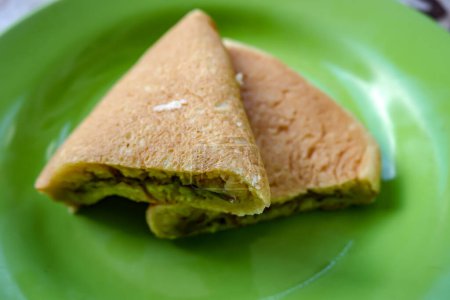 Two slices of sweet Martabak Cake on a green Plate - Indonesian Culinary