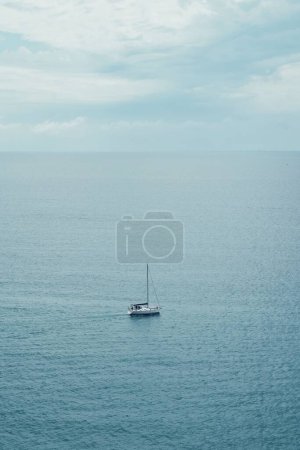 Photo for Lonely boat sailing in the Mediterranean Sea in Catalonia in Spain on June 1, 2023 - Royalty Free Image