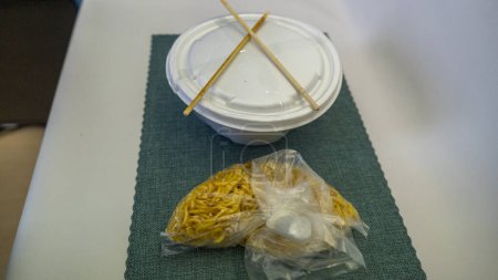 Yakissoba in lunchbox and bowl with Chique Hashi