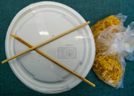 Yakisoba in lunchbox and bowl with Chique Hashi