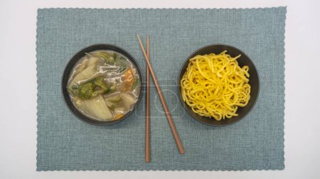 Photo for Yakisoba in lunchbox and bowl with Chique Hashi - Royalty Free Image