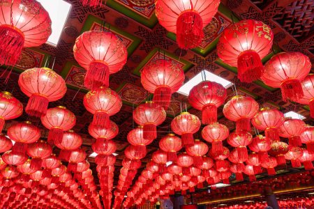 Photo for Red chinese lantern glowing ornamental hanging on ceiling of chinese temple in New Year festival - Royalty Free Image