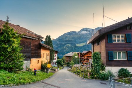 Beautiful rustic mountain village of Wengen on Bernese Oberland in the evening at Canton of Bern, Switzerland