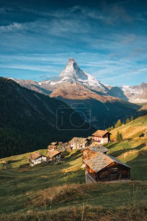 Beautiful landscape of Matterhorn iconic mountain, Swiss Alps with rustic village on hill in Findeln, Switzerland