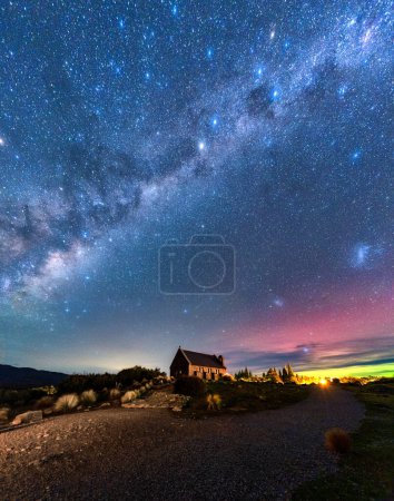 Fantastic nightscape of Milky Way, Nebula, Aurora Australis glowing over Church of the Good Shepherd at Lake Tekapo, New Zealand