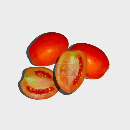 A  group of fresh red tomatoes isolated on white background.