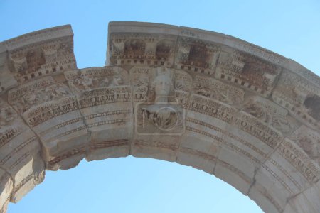 Photo for Efesus Turkey closeup of the reliefs of the arch at the temple of Hadrian showing the relief of the goddess of vicotry Tyche as well ornamental reliefes. - Royalty Free Image