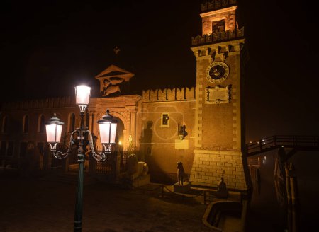 This is an image of the Arsenale, Venice, Italy. The image was taken from the front and was shot at night when the structure and surrounding area was illuminated.