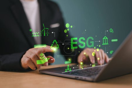 ESG environment social governance concept. Man use computer analyze ESG icon. Green environmental business finance strategy concept. ECO corporate company report, sustainable business investment