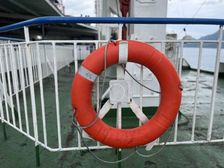 The ship's ring buoy hangs on the iron railing for emergencies if an accident occurs