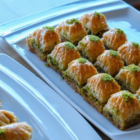 Photo for Turkish sweets baklava stuffed with pistachios - Royalty Free Image