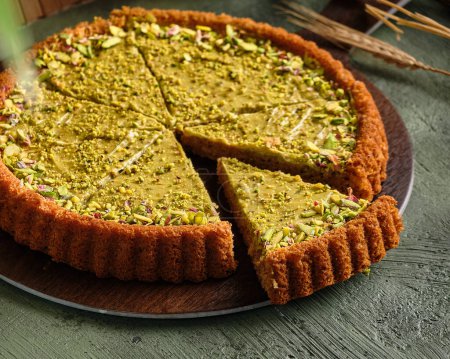 Photo for Pistachio cake on green background - Royalty Free Image