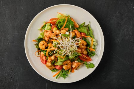 Photo for Close up photo of Seafood salad with shrimp, salmon, and fresh vegetables - Royalty Free Image