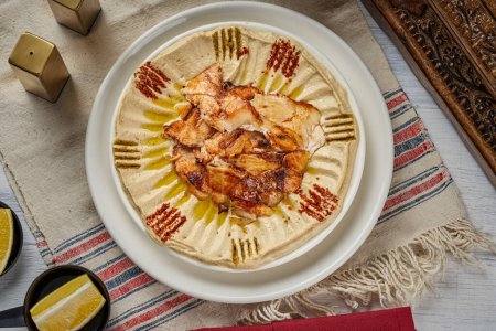 Photo for A plate of hummus appetizers with chicken shawarma - Royalty Free Image
