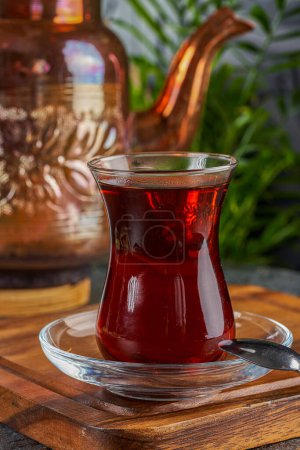 Traditional Turkish tea cup with copper utensils