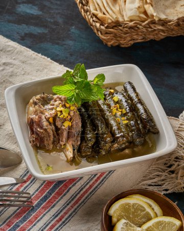 A plate of grape leaves stuffed with rice and meat