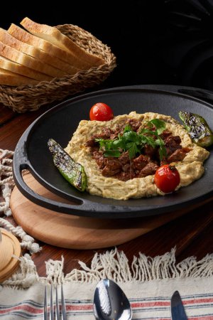 photo of a lamb dish with baba ghanoush
