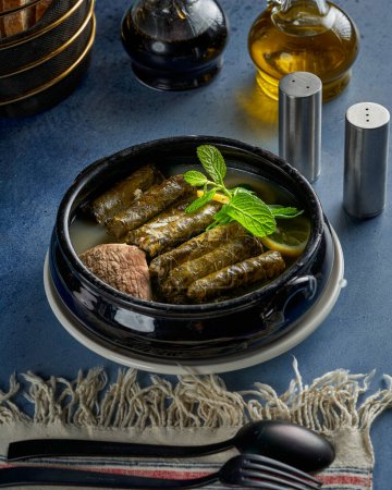 Photo for A plate of grape leaves stuffed with rice and meat - Royalty Free Image