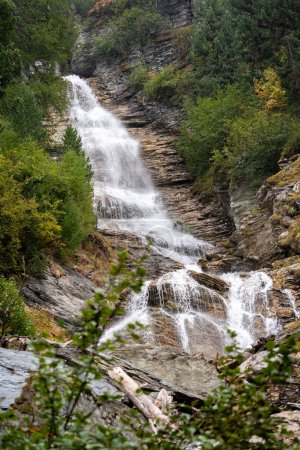 Photo for Gentle waterfall in the alpine mountains of Switzerland - Royalty Free Image