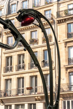 Photo for Typical art nouveau red lamp in the underground station in paris - Royalty Free Image