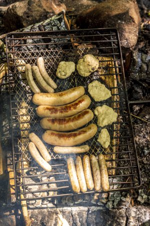 Photo for Grilled sausages and chipolatas on the grill - Royalty Free Image