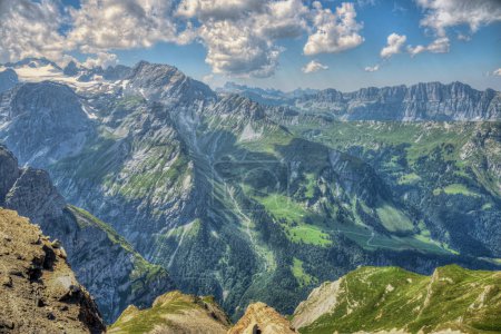 view from the top of the mountain to the valley in Glarus, switzerland