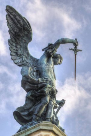 Photo for Bronze statue of Michael the Archangel, standing on top of St. Angelo's castle - Royalty Free Image
