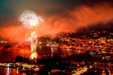 fireworks at the lake of lugano during the swiss national day celebration