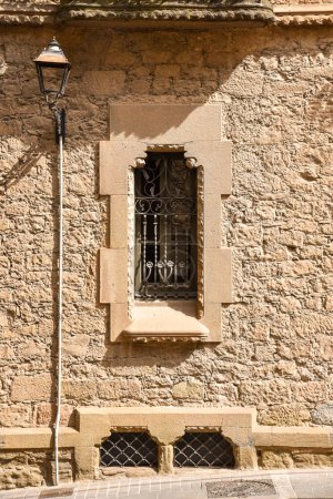 Old street window with old stone frame in the medieval catalonian town of Solsona in Catalonia, spain