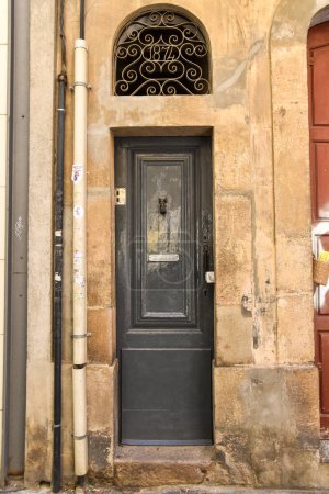 old door on the streets of barcelona, catalona, spain