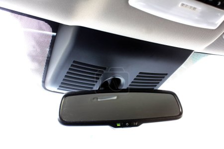 Rear view mirror inside the electric car. Lane Keeping System. Lane Departure Warning System. Cameras built into the windshield, along with other Sensors, to provide features like Emergency Braking.