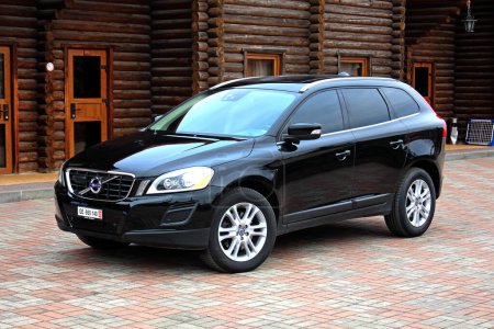 Photo for Vinnytsia, Ukraine; March 23, 2024. Black Volvo XC60 2012 at the city street. Sweden SUV Volvo XC60 at the parking. Front left view. - Royalty Free Image