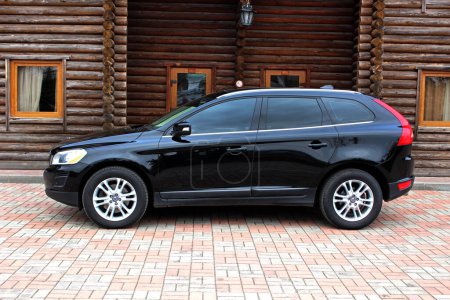 Photo for Vinnytsia, Ukraine; March 23, 2024. Black Volvo XC60 2012 at the city street. Sweden SUV Volvo XC60 at the parking. Left side view. - Royalty Free Image