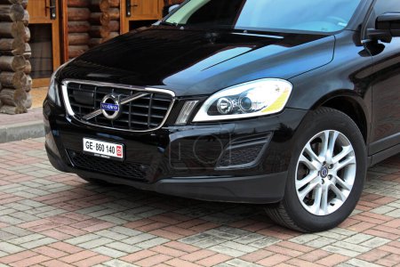 Photo for Vinnytsia, Ukraine; March 23, 2024. Black Volvo XC60 front of the car. SUV Volvo XC60 front bumper and grill. - Royalty Free Image