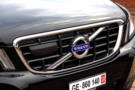 Photo for Vinnytsia, Ukraine; March 23, 2024. Black Volvo XC60 radiator grill. SUV Volvo XC60 front bumper. Volvo XC60 emblem and logo. Right view. - Royalty Free Image