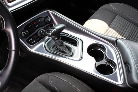 Supercharged muscle car Automatic gearbox lever. Automatic gear stick inside modern car. Detail on a automatic gear shifter in a car.