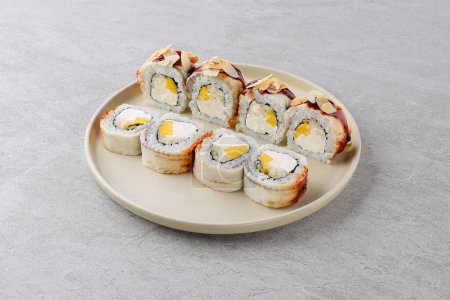 Photo for Sushi delivery. Set of rolls in a disposable box on a black background - Royalty Free Image