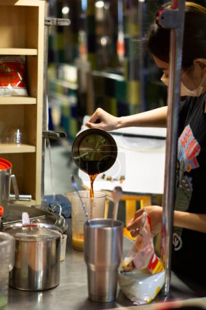 Photo for Thai Tea In Making, Exploring Night Market Refreshments in Xiaoliuqiu Taiwan - Royalty Free Image