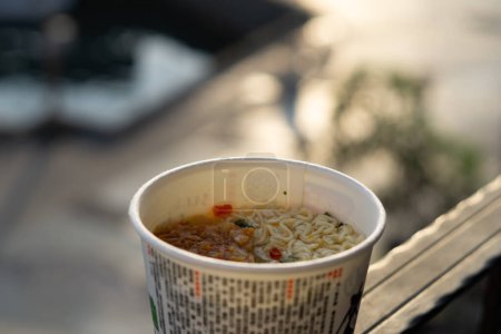 Photo for Sunrise Splendor, CloseUp Instant Noodle Bokeh with Taiwan Sky and Ocean Beauty - Royalty Free Image