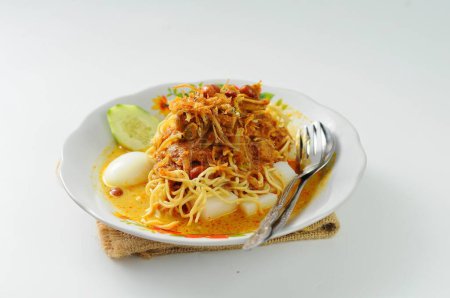 Photo for Lontong Mie is a native food from East Java (Jatim). Surabaya's culinary preparation, a typical coastal food, is a combination of pieces of lontong, local yellow noodles, fried tofu, bean sprouts, - Royalty Free Image