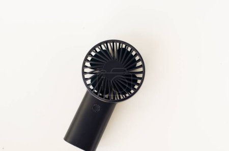 portable mini fan on plain background
